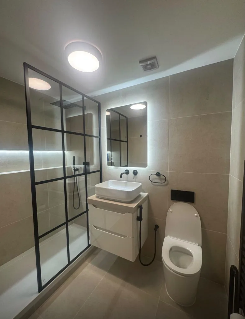 Wide view of a shower room with Crittall-style enclosure