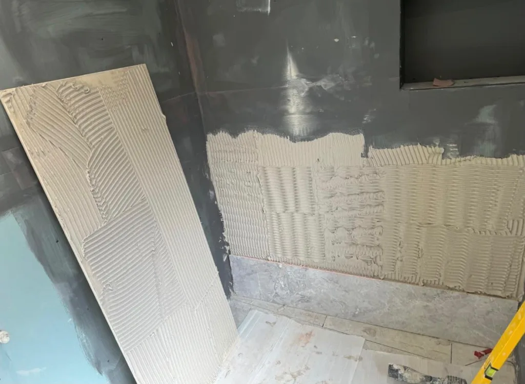 Tanking, then adhesive